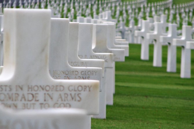 The engraved marker of an unknown soldier at the Normandy American Cemetery