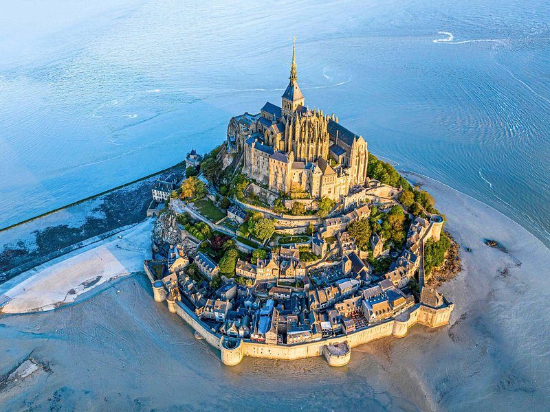 Mont-Saint-Michel from directly above, ringed by wet sand