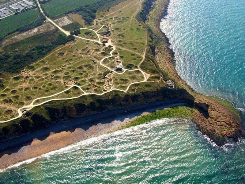 The Normandy coast from the air, cliffs falling to a wide beach
