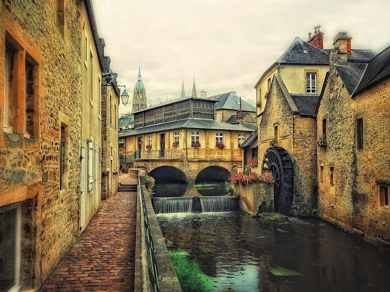 The old water mill and the river Aure running through Bayeux